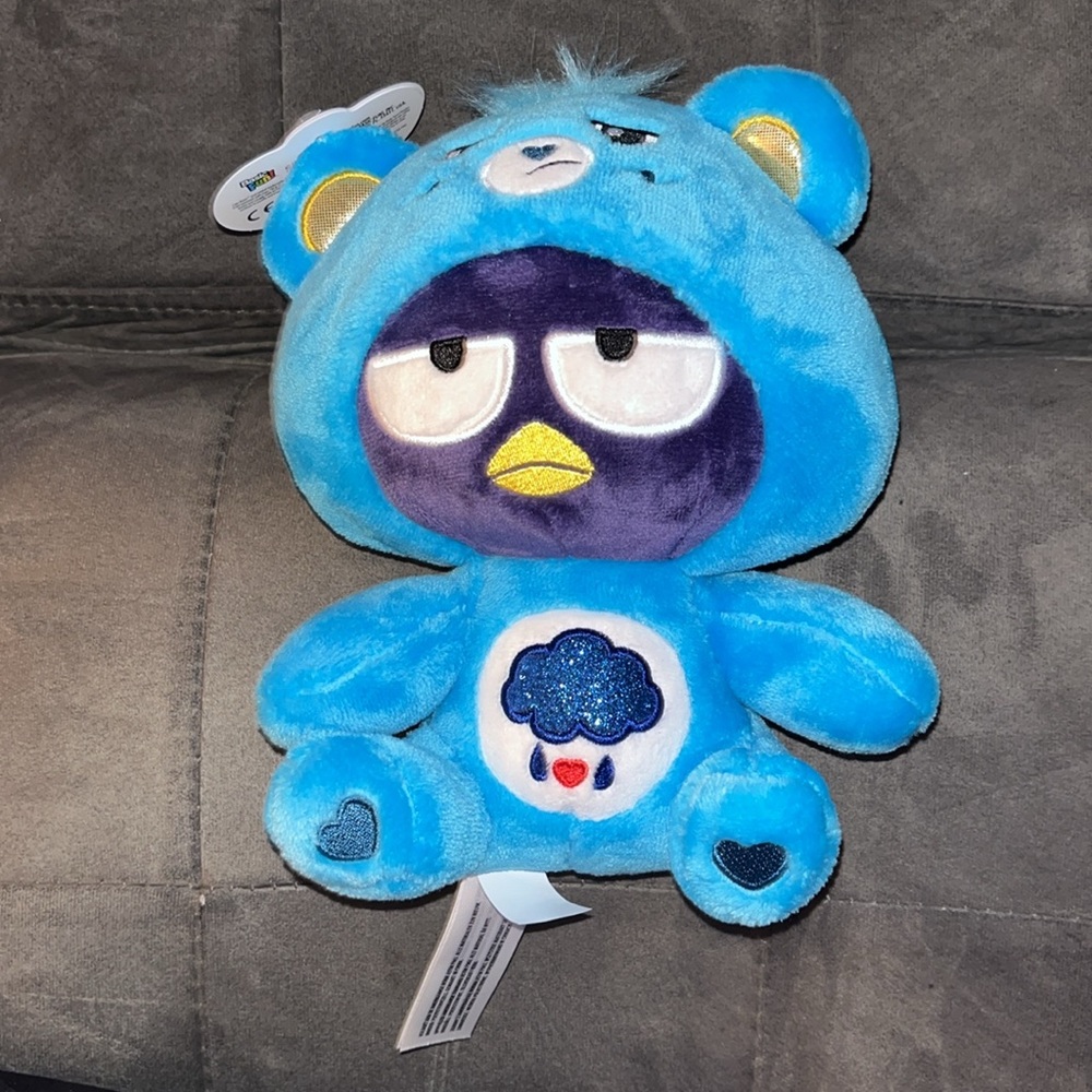 🆕 Care Bears Hello Kitty Fun Size Plush - Badtz-Maru as Grumpy Bear
